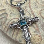 Silver & 14 Karat Cross set with Blue Topaz