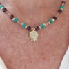 Gold hammered pomegranate pendant on Turquoise, Amethyst & Gold beaded necklace