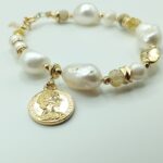 Designer Large pearl bracelet with A touch of Gold elements & semi precious stones