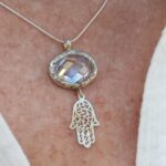 925 sterling silver oval faceted CZ with dangling Hamsa
